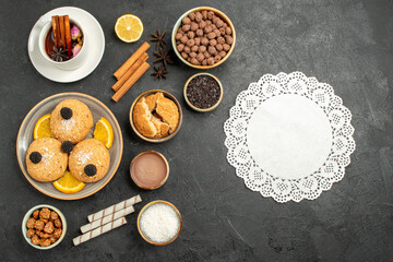 top view yummy cookies with cup of tea on dark background cake pie sugar dessert biscuit tea cookies