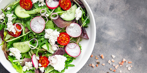 salad cheese green leaves vegetable radish, tomato, cucumber meal food snack on the table copy space food background rustic top view 