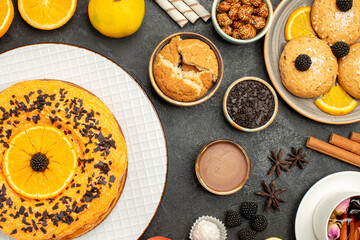 top view yummy fruity cake with cookies and cup of tea on a dark background biscuit cookie tea sweet cake pie