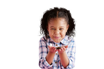 Portrait, excited and girl blowing confetti, celebration and kid isolated against transparent...