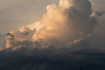 Fototapeta na wymiar Puffy dramatic stormy cumulus clouds
