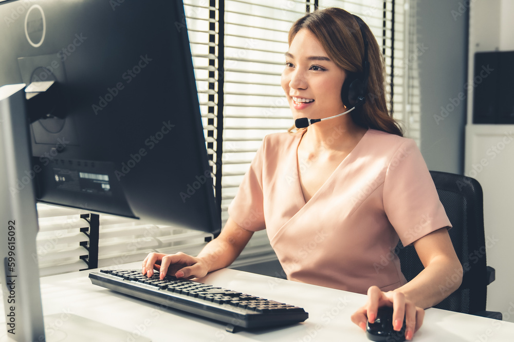 Aufkleber competent female operator working on computer and while talking with clients. concept relevant to bo