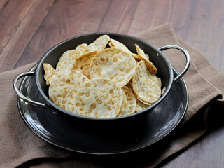 Keripik tempe ,traditional javanese food made from thinly sliced tempeh are then fried using seasoned flour. Usually the taste is salty with a savory aroma of onions