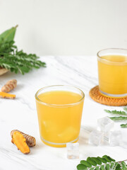 Es sinom or sinom drink ice. Sinom is a traditional Indonesian drink made from tamarind, tamarind leaves and turmeric. Healthy and refreshing