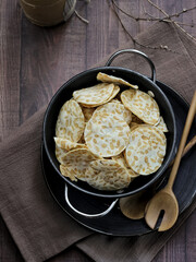 Keripik tempe ,traditional javanese food made from thinly sliced tempeh are then fried using seasoned flour. Usually the taste is salty with a savory aroma of onions