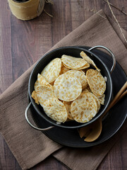 Keripik tempe ,traditional javanese food made from thinly sliced tempeh are then fried using seasoned flour. Usually the taste is salty with a savory aroma of onions