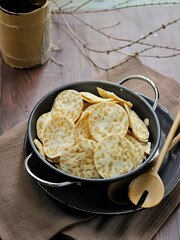 Keripik tempe ,traditional javanese food made from thinly sliced tempeh are then fried using seasoned flour. Usually the taste is salty with a savory aroma of onions