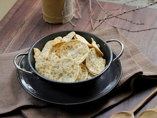 Keripik tempe ,traditional javanese food made from thinly sliced tempeh are then fried using seasoned flour. Usually the taste is salty with a savory aroma of onions