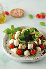A plate with Italian salad caprese canape