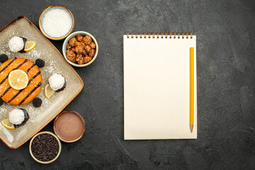 top view yummy little pie with coconut candies on dark background cake tea biscuit cookie sweet