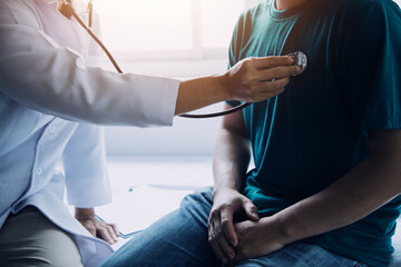 Male patient having consultation with doctor or psychiatrist who working on diagnostic examination...