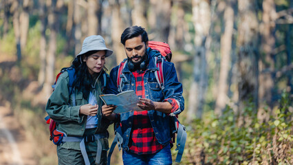 Happy Travelers Hiking with Backpacks on the Beautiful Rocky Trail at Warm Sunny. Hikers with backpacks walks in mountains. travel in the mountains with backpacks. Travel in the mountain with backpack