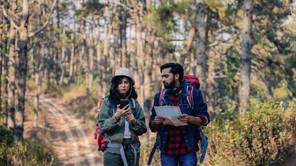 Happy Travelers Hiking with Backpacks on the Beautiful Rocky Trail at Warm Sunny. Hikers with backpacks walks in mountains. travel in the mountains with backpacks. Travel in the mountain with backpack