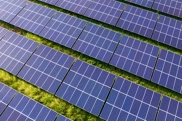 Rows of polycrystalline solar panels. Former farmland or agricultural areas in the countryside used as a solar farm.