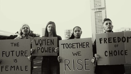 Demonstration of feminist movement protesting for female rights - Women empowerment concept - Black and white editing