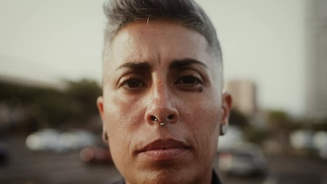 Lesbian woman looking at the camera outdoor