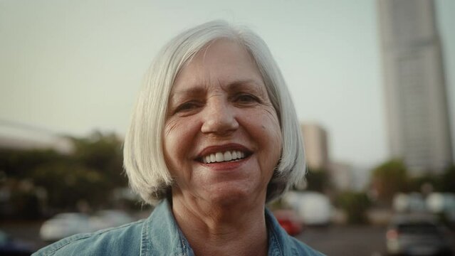 Happy senior woman smiling in front of camera - Elderly people lifestyle concept