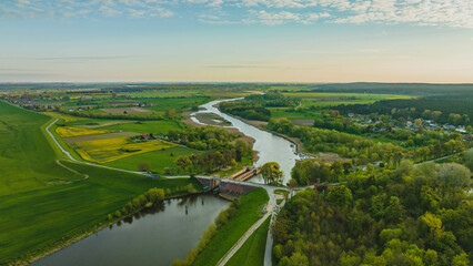 Fototapeta na wymiar Floodgate in Biała Góra. Where the Nogat River flows from the Vistula. View from the drone, morning, spring. Poland.