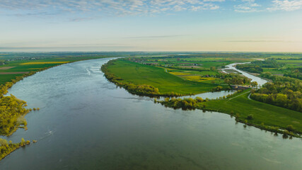 Floodgate in Biała G&oacute;ra. Where the Nogat River flows from the Vistula. View from the drone, morning, spring. Poland.