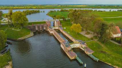 Obraz premium Floodgate in Biała Góra. Where the Nogat River flows from the Vistula. View from the drone, morning, spring. Poland.