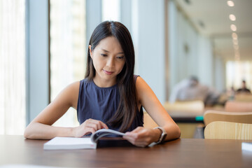 Woman read the book in library