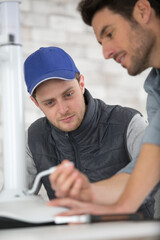 handyman adjusting lever on stool