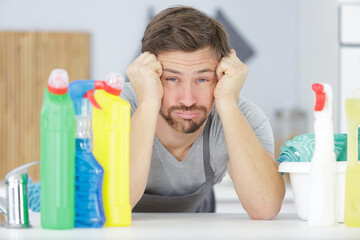 domestic service man or tired husband doing housework - obrazy, fototapety, plakaty