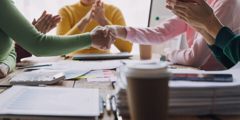 Brainstorming Collaboration and successful partnership analysis by Young business Asian people working in an office workspace