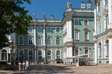 Fototapeta na wymiar One of the main attractions of St. Petersburg is the Hermitage, the Winter Palace. Fragment of the facade on summer day