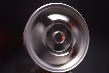 old car wheels titanium rims retro light alloy in a dark room long exposure photo