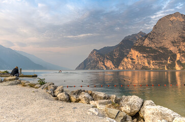 City of Riva del Garda by Garda lake in Italy. View from the lake shore