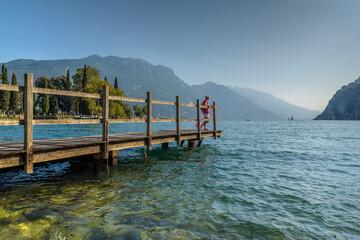 City of Riva del Garda by Garda lake in Italy. View from the lake shore