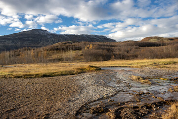 Landscape with geysir water and mountains, Iceland