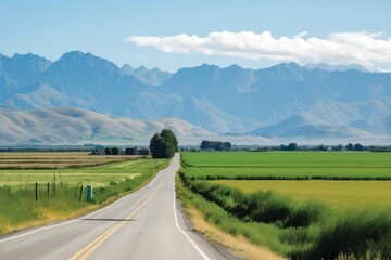 scenic highway, with fields and crops in the foreground and mountains in the background, created with generative ai