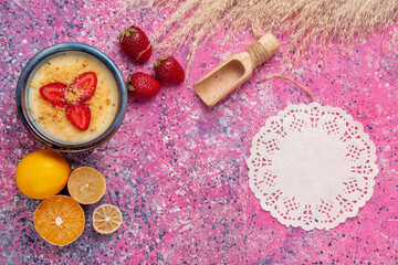 Fototapeta na wymiar top view delicious creamy dessert with fresh lemon on light-pink background dessert ice-cream berry cream sweet fruits