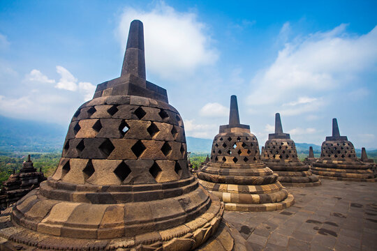 The stupas are lined up in the Borobudur Temple complex. Borobudur Temple is the largest Buddhist temple in the world, located in Magelang, Yogyakarta, Indonesia.