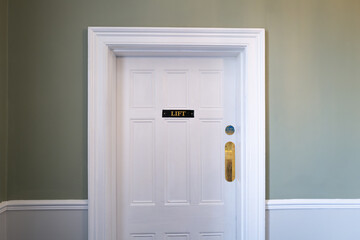 Entrance to an internal lift seen within a once stately home now a luxury hotel.