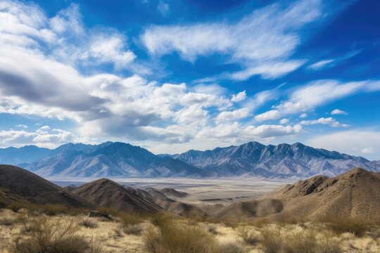majestic mountain range with rolling clouds and blue skies, created with generative ai
