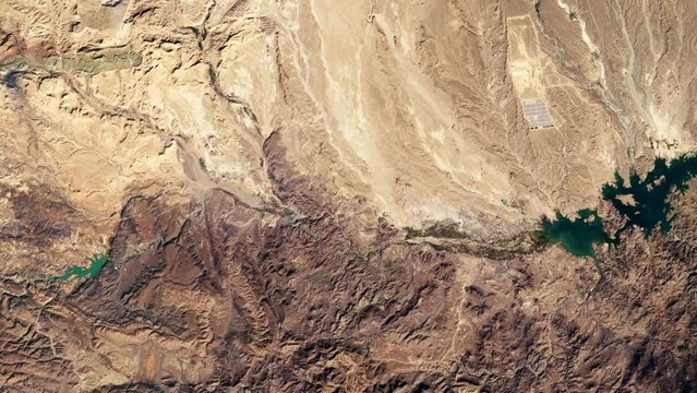 Water reservoir shrinking time lapse, aerial satellite view of Morocco landscape. Based on image by Nasa
