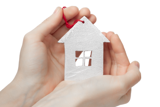 Wooden house model in hands on white background