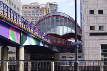 London, UK: DLR (Docklands Light Railway) train running towards Heron Quays Station in Canary...