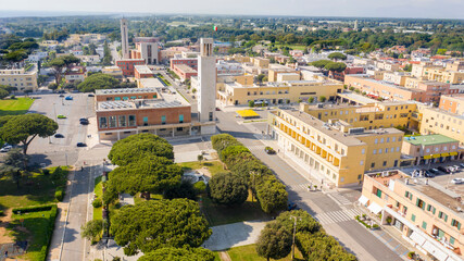 Aerial view of the main square, the civic tower and church of the Santissima Annunziata in the historic center of Sabaudia, in the province of Latina, Italy.