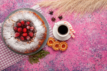 top view delicious strawberry cake sugar powdered with cup of tea and cookies on light pink background cake sweet biscuit cookie tea