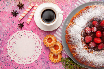 top view delicious strawberry cake sugar powdered with cup of tea and cookies on light pink background cake sweet biscuit cookies tea