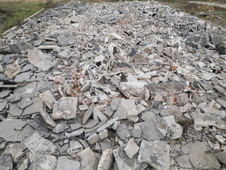 Aftermath after war debris rubble demolition ruin ruined field area concrete building part pile...