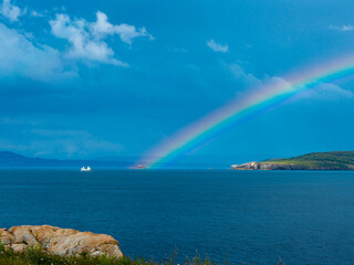 nice rainbow on the sea coast
