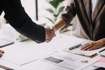 Business handshake for teamwork of business merger and acquisition,successful negotiate,hand shake,two businessman shake hand with partner to celebration partnership and business deal concept