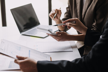 Businesswoman or accountant working Financial investment on calculator, calculate, analyze business and marketing growth on financial document data graph, Accounting, Economic, commercial concept.