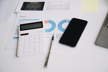 Businesswoman or accountant working Financial investment on calculator, calculate, analyze business and marketing growth on financial document data graph, Accounting, Economic, commercial concept.