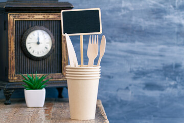 Zero waste, plastic free,recyclable, sustainable utensils including fork, spoon, knife, cups, napkin and a bag with copy space. Can be used as a food delivery ad...